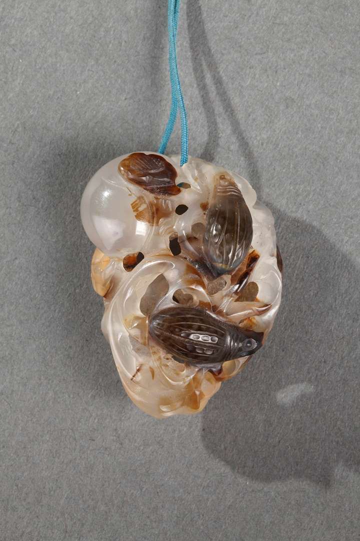 Agate pendant in the shape of fruits and insects carved in the brown vein